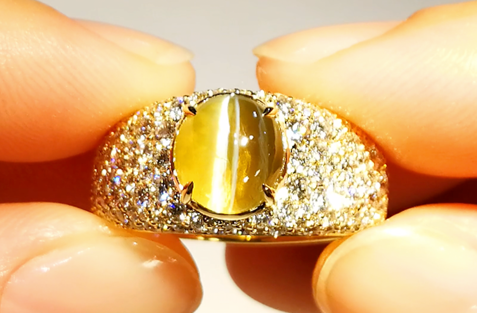 Ceylon Milk & Honey Cats Eye Chrysoberyl Ring with D Flawless Diamonds set in 18K Yellow Gold
