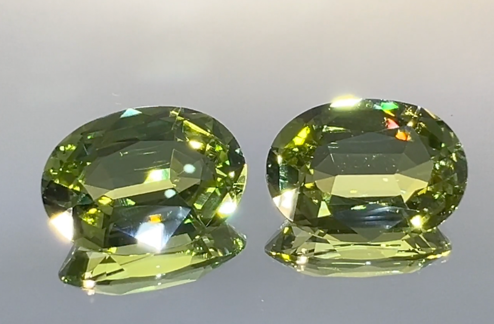 24.20ct Unheated Racing Green Paraiba Earrings with D Flawless Diamonds set in 18K Yellow Gold
