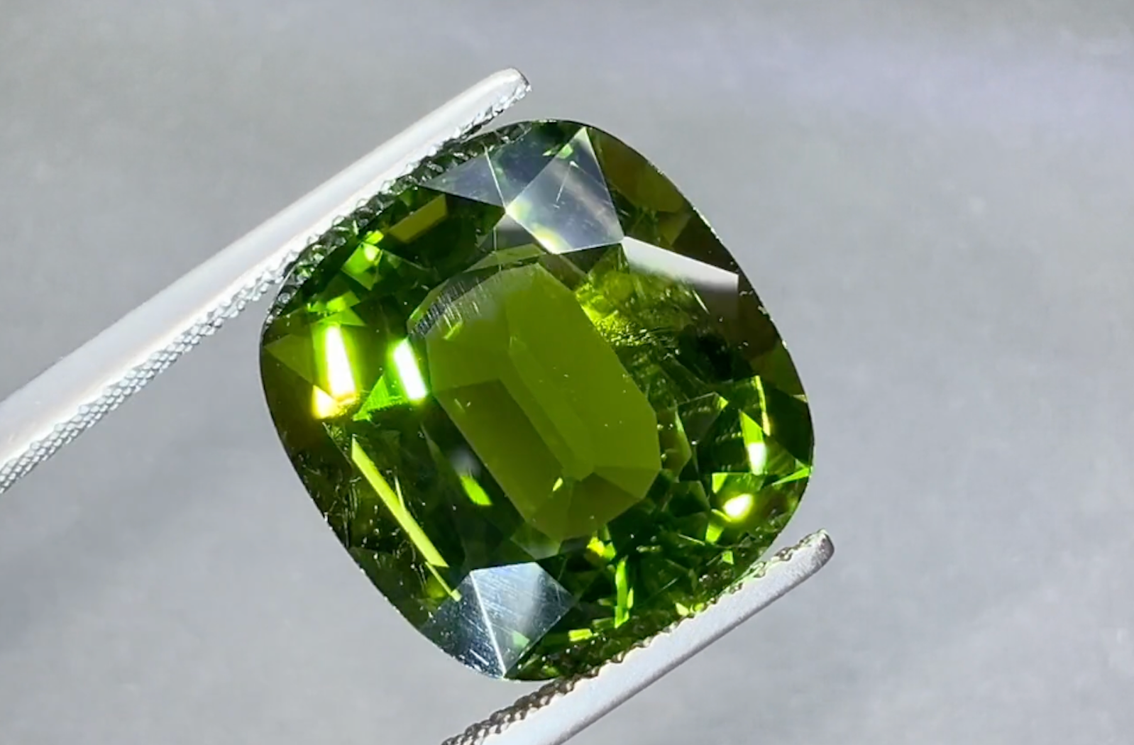 13.53ct Loupe Clean Neon Racing Green Paraiba Tourmaline Ring with D Flawless Diamonds set in 18K White Gold