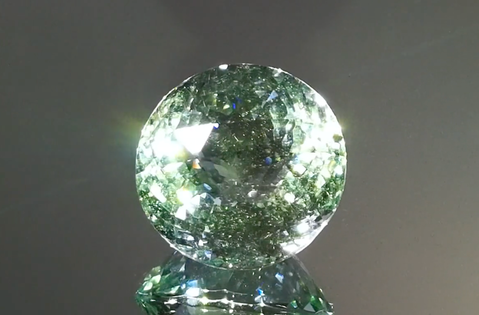 32.53ct Unheated Green Beryl Ring with D Flawless Diamonds set in 18K Yellow Gold